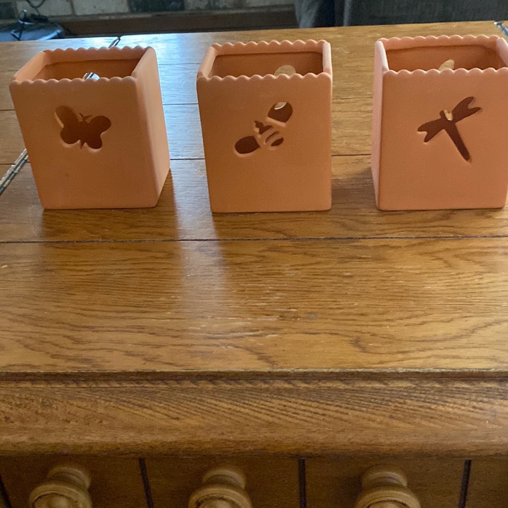 New candle holders. Never used.  $9 for all 3. Terracotta